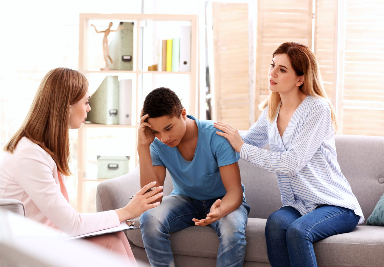 mother and son with their therapist